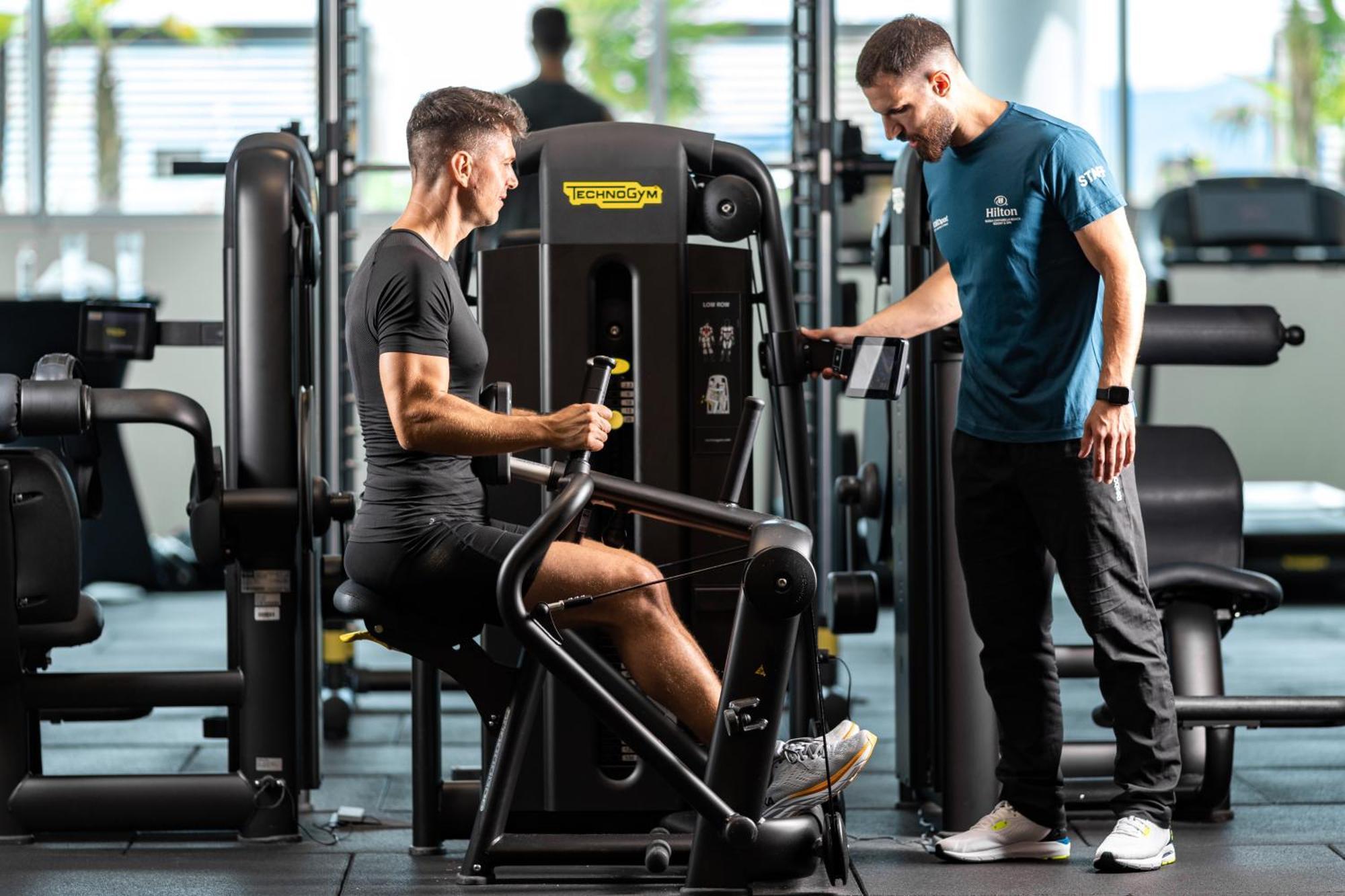Hilton Rijeka Costabella Beach Resort And Spa Dış mekan fotoğraf Personal trainer with a client